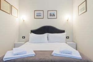 Posteľ alebo postele v izbe v ubytovaní Milan Retreats Cadorna Duomo