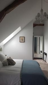 Postel nebo postele na pokoji v ubytování Les 7 Tilleuls - Chambres d'hôtes