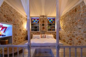 Postel nebo postele na pokoji v ubytování Aphrodite Villas Halki - Studio Rosa