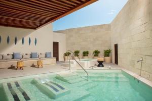 The swimming pool at or close to Dreams Aventuras Riviera Maya - All Inclusive