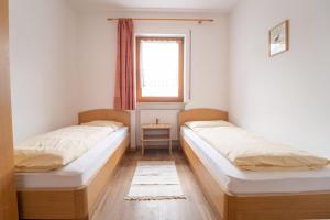 Ένα ή περισσότερα κρεβάτια σε δωμάτιο στο Unterbrunnerhof