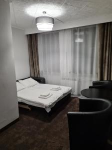 Postel nebo postele na pokoji v ubytování Hotel Kolorowa