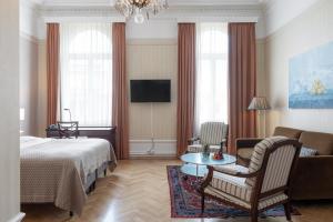Postel nebo postele na pokoji v ubytování Elite Plaza Hotel + 37 fotografií