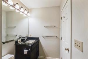a bathroom with a sink and a mirror at Pico F305 in Killington +14 photos