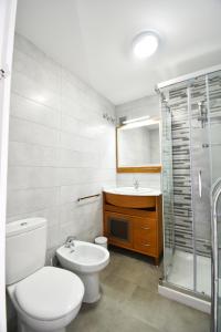 Koupelna v ubytování Apartamento Familiar Caracola Playa + 8 fotografií