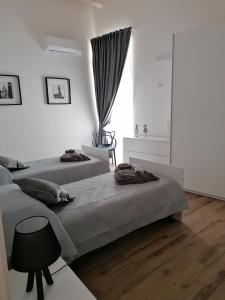 Postel nebo postele na pokoji v ubytování B&B Curtopassi