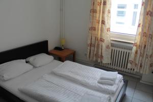 Postel nebo postele na pokoji v ubytování Hotel Lilienhof