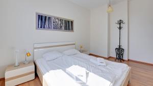Łóżko lub łóżka w pokoju w obiekcie Dom & House - Apartments Parkur Sopot