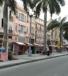 a city street with palm trees and a street sign at Hotel Casa Blanca - Adults Only in Rio de Janeiro
