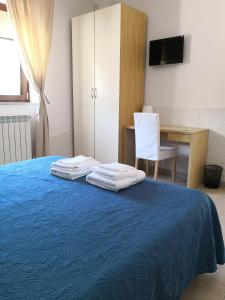 Posteľ alebo postele v izbe v ubytovaní Dimora Mariù - Casa Vacanze