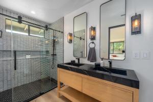 a bathroom with a black sink and a shower at @ Marbella Lane - The Wine Mine Desert Escape in Joshua Tree +66 photos