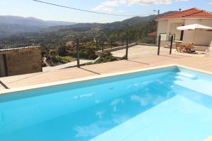 a swimming pool in a villa with a view at Casa da Sacota - Douro View in Baião