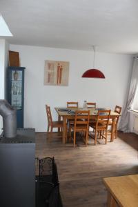 a kitchen and dining room with a table and chairs at Rivendell 9 in Monschau +75 photos