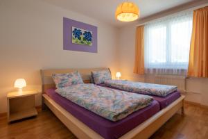 Postel nebo postele na pokoji v ubytování Haus Aurora