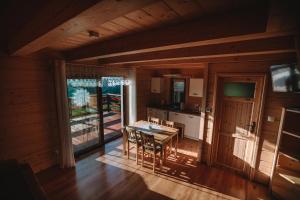 an overhead view of a kitchen and dining room in a cabin at Domek w Korycie -Apartament 5-7 osobowy, Apartament 2 osobowy in Koniaków