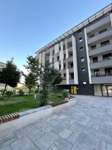 a parking lot in front of a building at NEVA APARTMENT in Belgrade