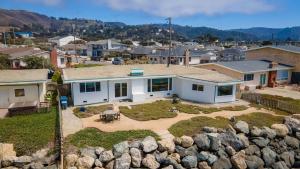 an aerial view of a house with a yard at @ Marbella Lane - Oceanfront w/ unobstructed views!! in Pacifica