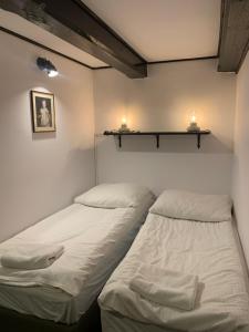 A bed or beds in a room at Ojcówek