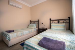 A bed or beds in a room at Villa Etki