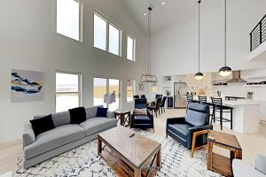 a living room with a couch and a table at Sunlight cottage in Steamboat Springs