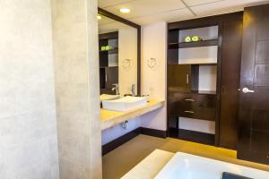 A bathroom at Aldea Beachside Condo by BVR