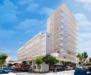 a tall white building on a city street at Hotel Kilimanjaro in El Arenal