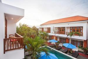 an aerial view of a hotel with a swimming pool at Sahadewa Suites Residence in Kerobokan