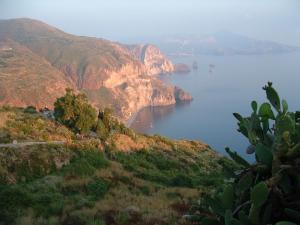 a view of a large body of water with mountains at Bed and Breakfast Villa Angelina in Lipari