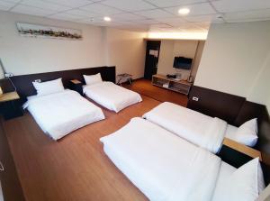 Voodi või voodid majutusasutuse 富裕商旅 RICH-hotel toas