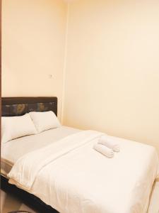 מיטה או מיטות בחדר ב-La Tana Hotel