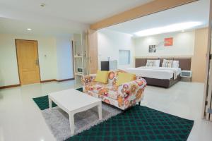 מיטה או מיטות בחדר ב-Taragrand Donmuang Airport Hotel