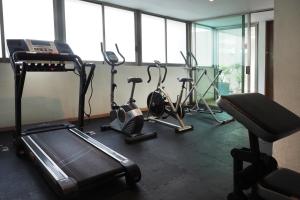 a gym with several exercise bikes in a room at Encantador Berlin By The Local Way in Mexico City