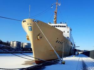 a large boat is docked in the snow at Laivahostel S/S Bore in Turku