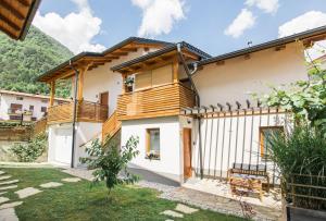 a house with a wooden fence in front of it at Pr' Petrču in Tolmin +23 photos