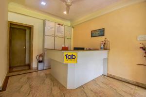 a restaurant with a job counter in a room at Sereniity Resort Lonavala in Lonavala