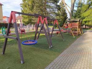 a park with a playground with swings at MyMara, Apartmán Beťo in Bešeňová