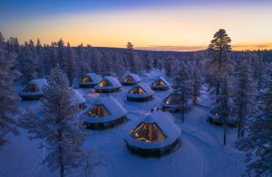 an aerial view of a group of tents in the snow at Wilderness Hotel Muotka & Igloos in Saariselka