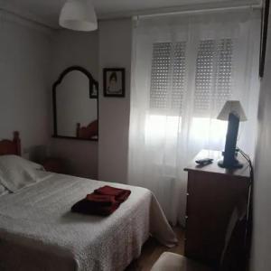 Postel nebo postele na pokoji v ubytování Luque
