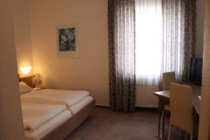מיטה או מיטות בחדר ב-Hotel Windfelder
