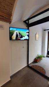 En TV eller et underholdningssystem på El Patinillo ENCANTO