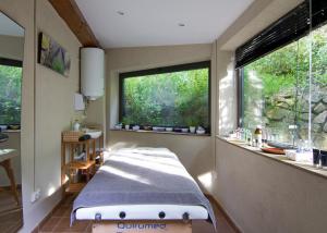 a room with a bed and a large window at Boutique Hotel Casa Granados in Tossa de Mar +36 photos