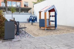 a playground in front of a building at Rewita Wrzeszcz Apartments by Renters in Gdańsk
