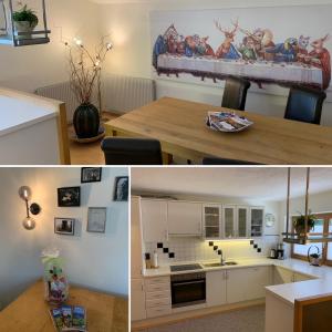 une cuisine avec une table et une salle à manger dans l'établissement Alpen Appartements Hochmuth, à Mayrhofen