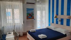 Postel nebo postele na pokoji v ubytování B&B Una Rotonda sul mare