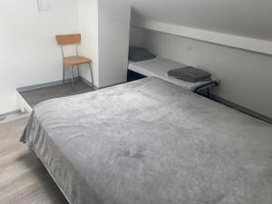 Postel nebo postele na pokoji v ubytování Résidence Les Vignerons