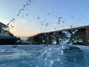 a splash of water in a swimming pool at Villa with jacuzzi in Nord Bjørøy