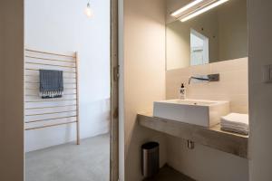 a bathroom with a sink and a mirror at Casa Luce in Torre di Palme +68 photos