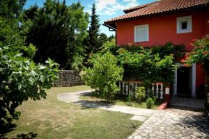 Vonkajšia záhrada v ubytovaní Apartment in Lopar with sea view, loggia, air conditioning, W-LAN 4229-6