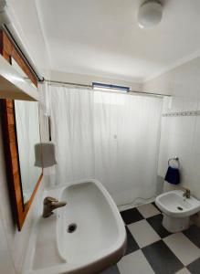 a bathroom with a white tub and a toilet at Termas da Sulfurea in Cabeço de Vide +19 photos