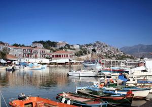 a bunch of boats are docked in a harbor at Triena Rooms in Mythimna